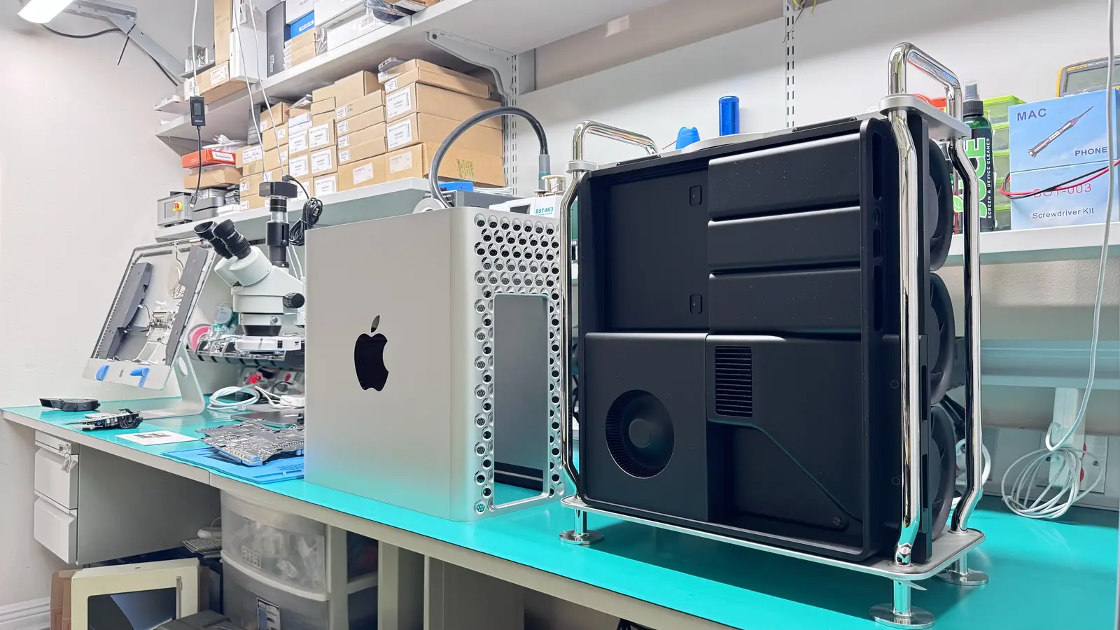 Mac Pro 2019 tower and classic cheese-grater Mac Pro side by side on WarriorMac repair workbench in Tampa