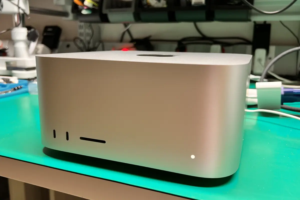 Mac Studio exterior on green workbench ready for professional repair at WarriorMac Tampa