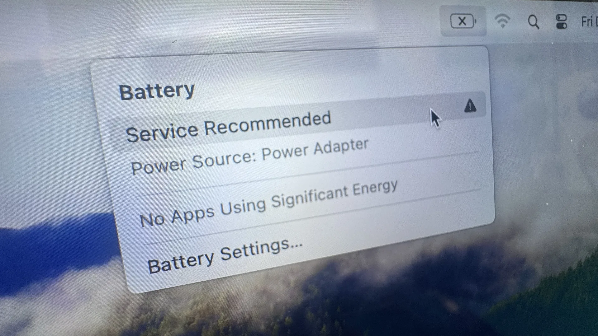 macOS Battery Service Recommended warning notification on MacBook screen at WarriorMac Tampa repair shop