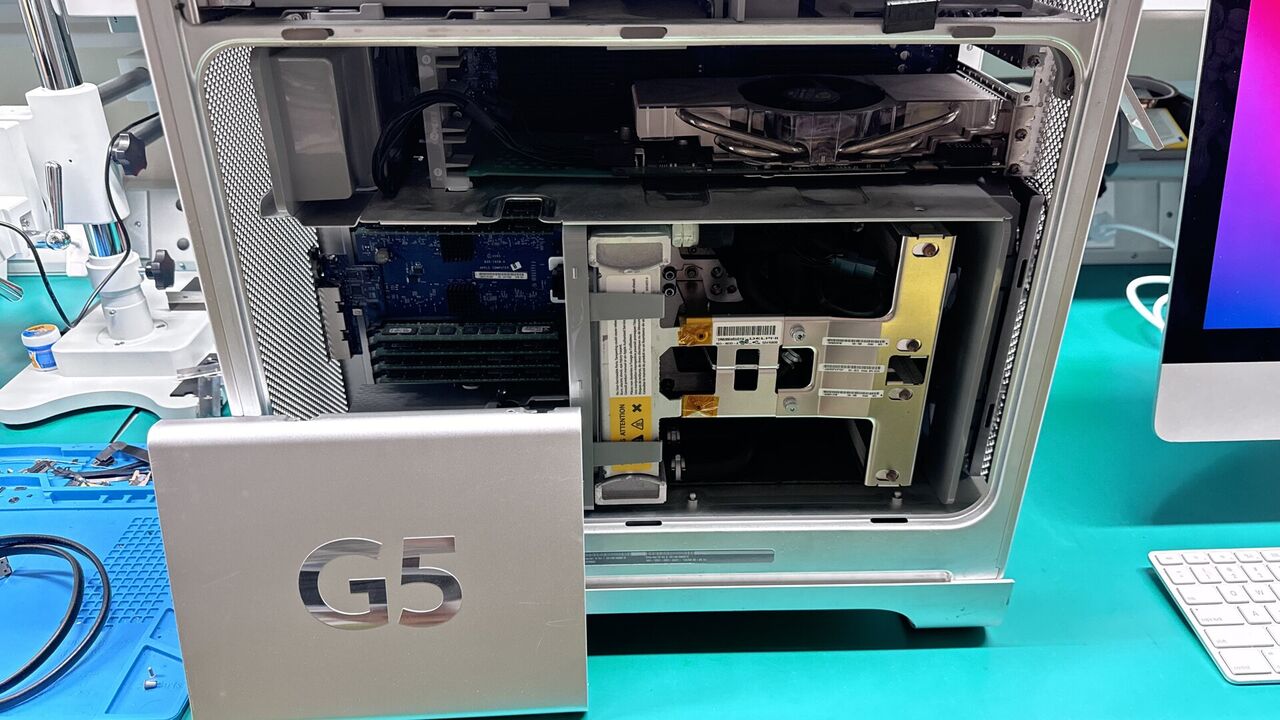 Mac upgrade and system optimization workstation at WarriorMac Tampa showing SSD and RAM components
